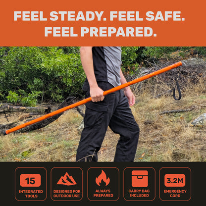 "Person hiking on trail holding orange Terra Tactic hiking stick for outdoor support"